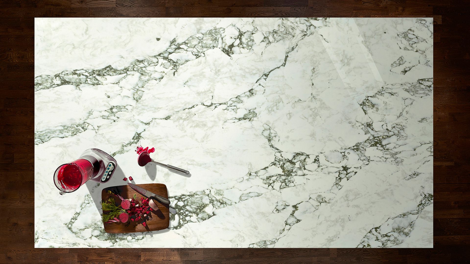 A marble worktop with a drink on it.